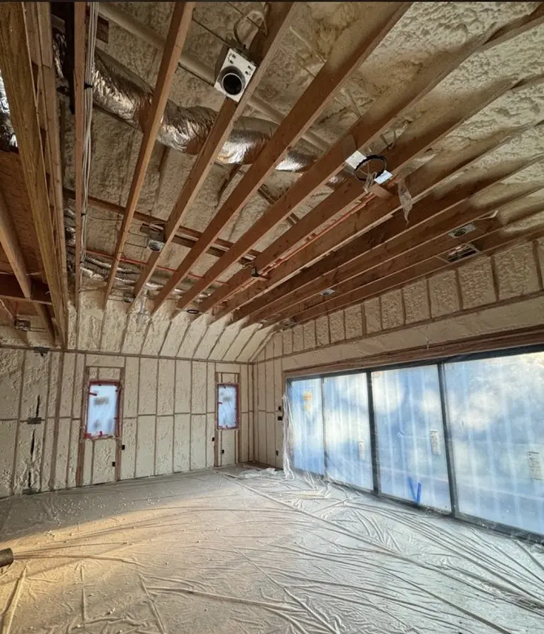 Interior walls and ceiling insulated with spray foam during new construction in Leesylvania
